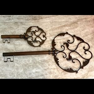 Two metal bronze colored decorative wall art